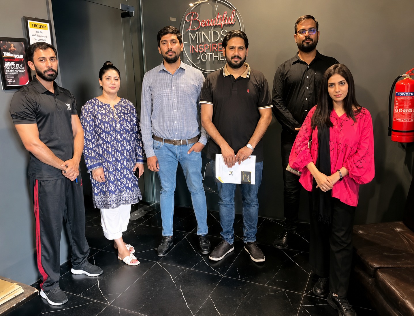 TECGym team celebrating successful gym software deployment